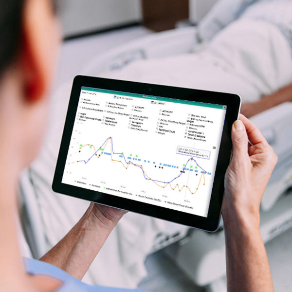 Nurse using ICNet Software on a tablet device